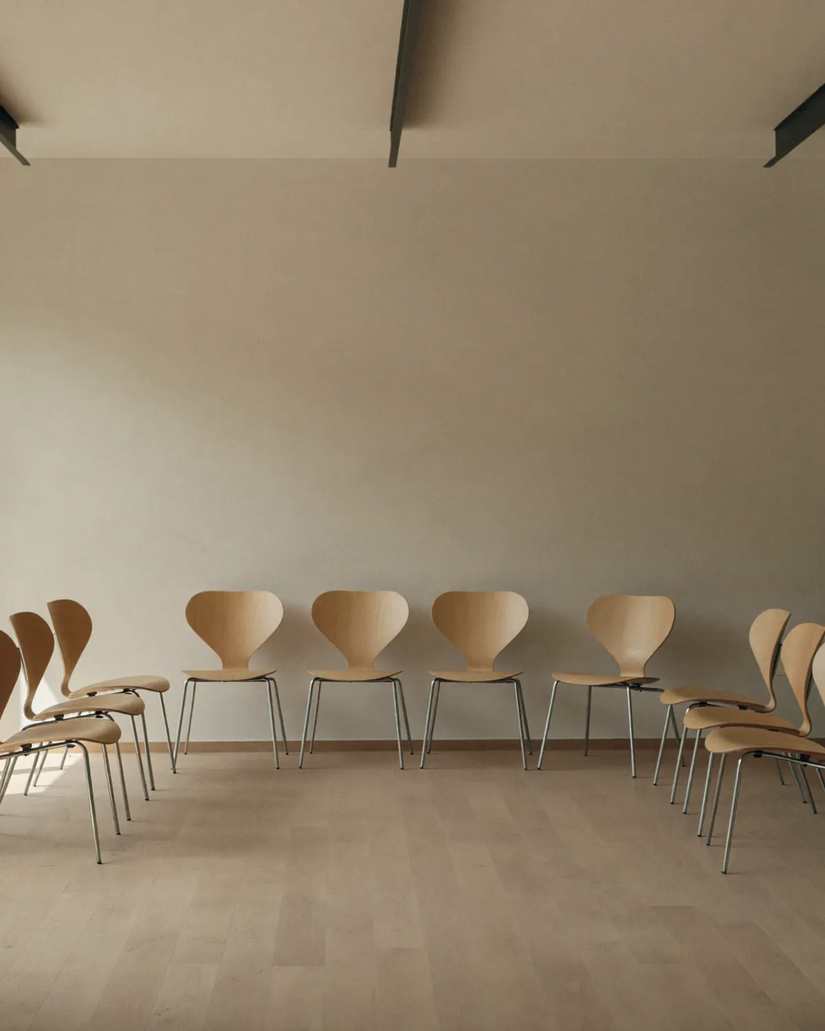 An empty training room set up before a session, with morning light across the floor
